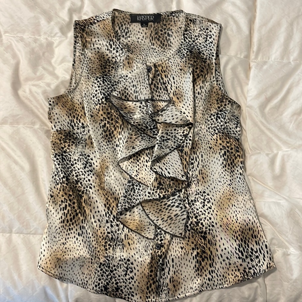 Satin print button up tank with ruffled front cover buttons.